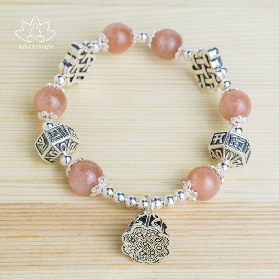 Sun stone bracelet with lucky silver charms