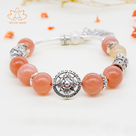 Pandora bracelet with sunstone and charms of Om Mani Padme Hum and vajra